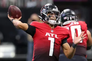 Player Passing A Football Wallpaper