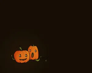 Playful Pumpkin Pals Halloween Aesthetic Wallpaper