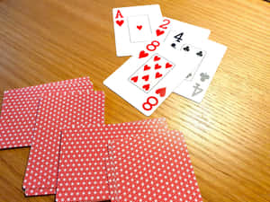 Playing Cardson Wooden Table Wallpaper