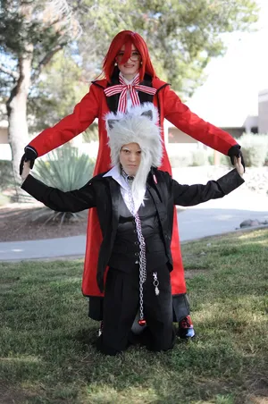 Pluto From Black Butler Showcasing His Fiery Skillset Wallpaper