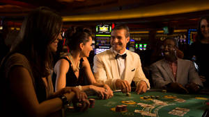 Poker Table With Man And Woman Wallpaper