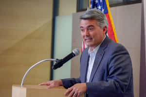 Politician Speakingat Podium Wallpaper