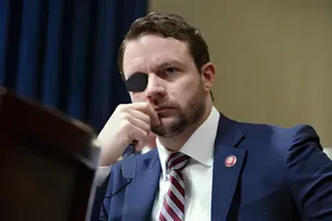 Politicianwith Eyepatchin Blue Suit Wallpaper