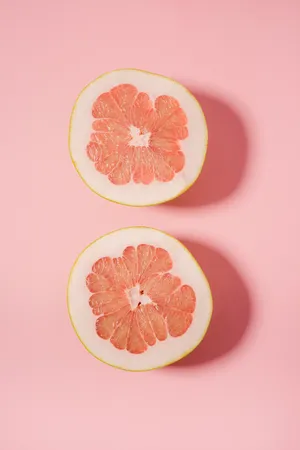 Pomelo On Pink Background Wallpaper