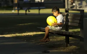 Poor Kid At The Park Wallpaper