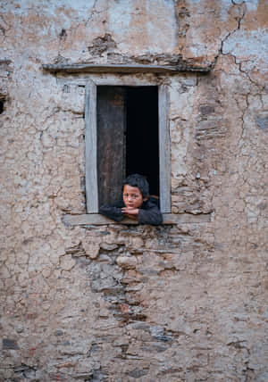 Poor Kid At The Window Wallpaper