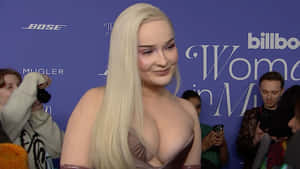 Pop Music Sensation Kim Petras Illuminating The Stage Wallpaper