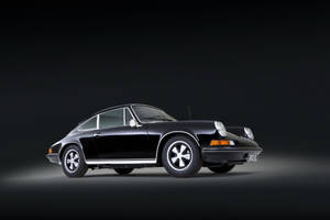 Porsche 911 In Sleek Black Paint Wallpaper