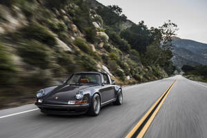 Porsche 911 Speeding In Country Road Wallpaper