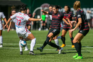 Portland Thorns Fc Athlete In Action On The Field Wallpaper