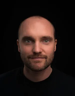 Portrait Of A Bald Man Smiling Wallpaper