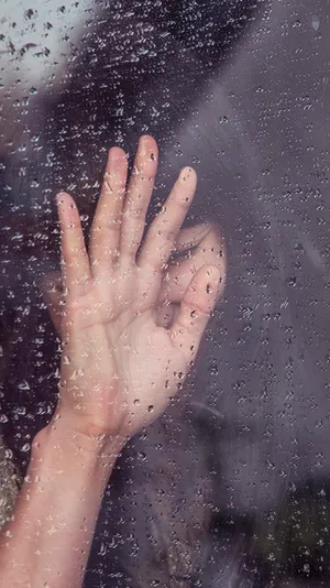 Portrait Of A Timid Woman Looking Away Wallpaper