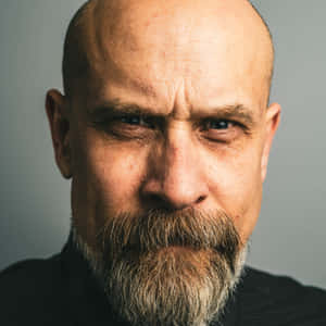 Portrait Of An Aged Man With A Bald Head Wallpaper