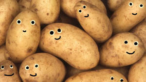 Potatoes Doodled With Goggly Eyes Wallpaper