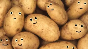 Potatoes Doodled With Goggly Eyes Wallpaper