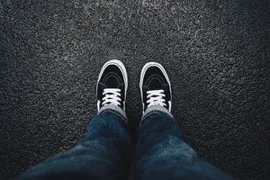 Pov Black Vans On Asphalt Wallpaper
