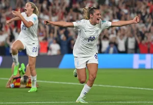 Power Kick - Young Female Soccer Player In Action Wallpaper