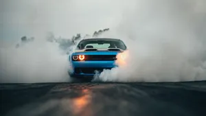 Power Unleashed - Dodge Challenger Erupting From Smoke Wallpaper