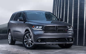 Powerful Dodge Durango Cruising On A Scenic Road Wallpaper