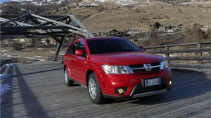 Powerful Fiat Freemont Cruising On Pathway Wallpaper