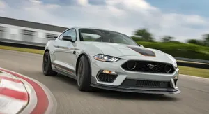 Powerful Ford Mustang Mach 1 On Open Road Wallpaper