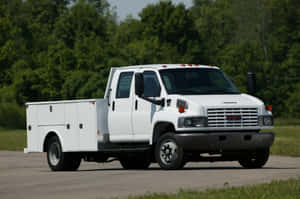 Powerful Gmc Topkick Truck On The Road Wallpaper