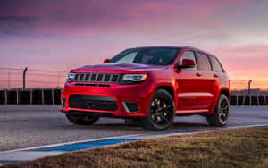 Powerful Jeep Grand Cherokee In Wilderness Wallpaper