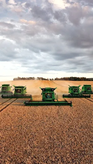 Powerful John Deere Tractor In Action Wallpaper