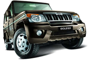 Powerful Mahindra Suv Driving Through Rough Terrain Wallpaper