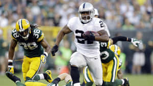 Powerful Nfl Running Back In Action Wallpaper