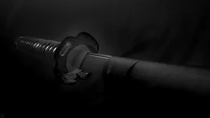 Powerful Samurai Sword Poised For Action Wallpaper
