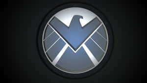 Powerful Shield On Dark Background Wallpaper