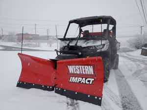 Powerful Snowplow Clearing The Way Wallpaper