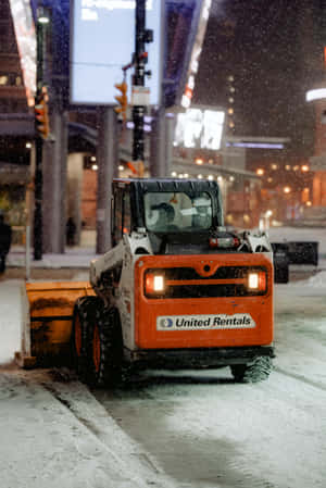 Powerful Snowplow Clearing Winter Road Wallpaper