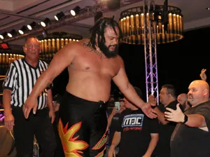 Powerhouse Wrestler Jacob Fatu Striking A Pose Wallpaper