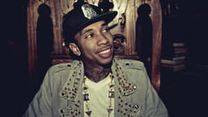 Powering Up: Hip Hop Artist Tyga Gets Lost In His Music Wallpaper