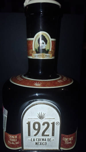 Premium 1921 Tequila In A Sophisticated Setting Wallpaper