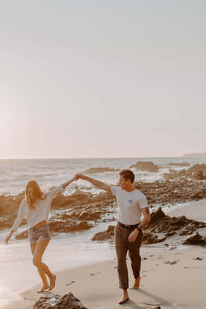 Preppy Couple Beach Stroll Wallpaper