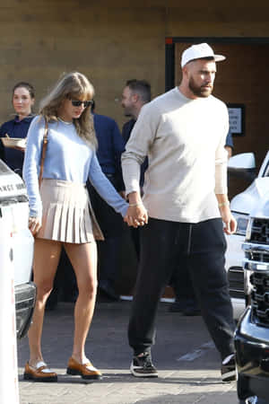 Preppy Outfit Celebrity Couple Walking Wallpaper