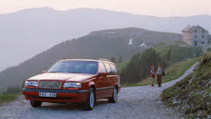 Pristine Condition Volvo 850 Gliding On The Highway Wallpaper