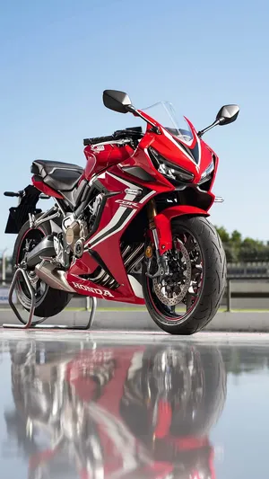 Pristine Honda Motorcycle On An Open Road Wallpaper