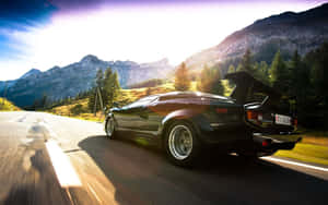 Pristine Lamborghini Countach In A Majestic Scenic Landscape Wallpaper