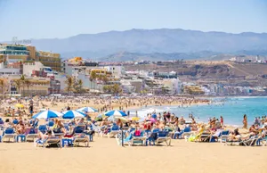 Pristine Spanish Beach At Sunset Wallpaper