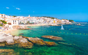 Pristine Spanish Beach With Crystal-clear Waters Wallpaper