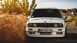 Pristine White Bmw Ready For A Drive Wallpaper