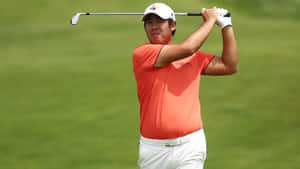 Pro Golfer Byeong Hun An Sporting An Orange T-shirt Wallpaper