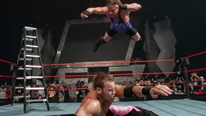 Pro Wrestlers Rob Van Dam And Christian Cage In Action Wallpaper