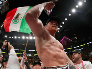 Professional Boxer Saul 'canelo' Alvarez Showcasing His Impressive Muscular Biceps Wallpaper