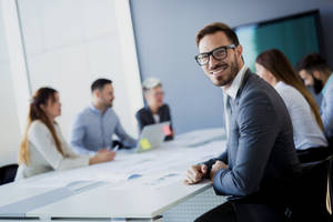 Professional Consultant Leading A Business Conference Wallpaper