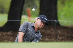 Professional Golfer Brian Harman In Action Wallpaper